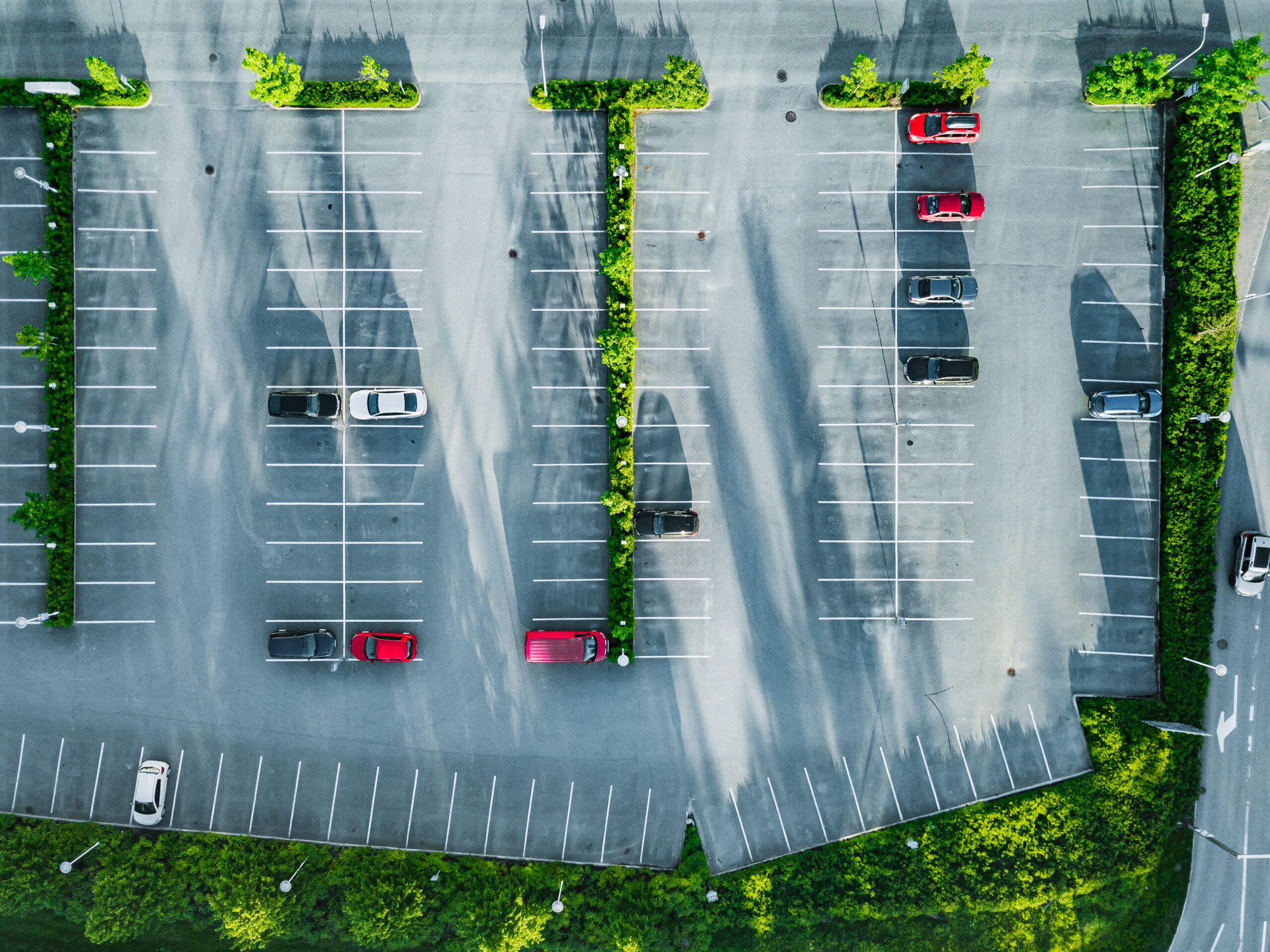 Aerial view of cars at car park, almost empty parking lot in Finland.
